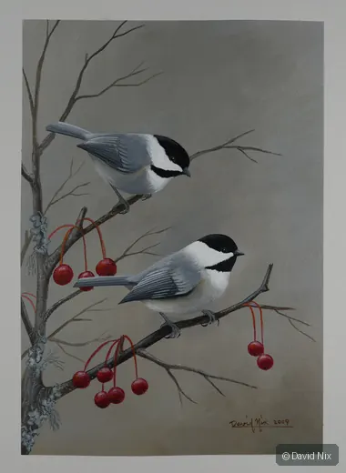 Two chickadees on winter branch with red berries.